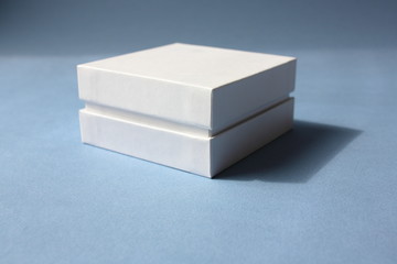 White paper gift box on a  blue background