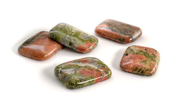 Rectangle cabochon cut unakite stones isolated on white background