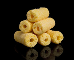 Corn sticks on a black background