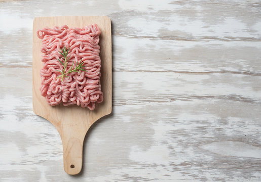 Raw minced pork uncooked on the cutting board,Top view.