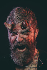 Halloween demon shout with bloody horns on head