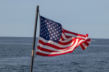 Flag flying on a ship in a gusty wind