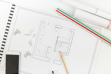 Interior designer table workplace with house plan