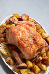 Whole roasted chicken with potato