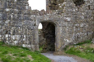 Arched stone doorway of an ancient castle ruins in County Laois, Ireland 