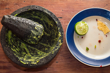 Mexican food, eaten, on rustic tabletop. Room for text