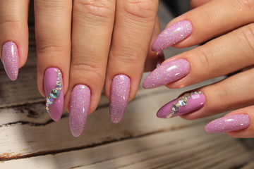 glamorous manicure of nails on beautiful female hands