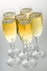 Six Champagne Glasses on Grey Background