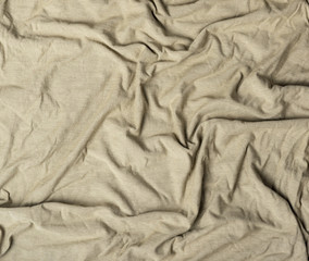 crumpled cotton fabric of gray color, abstract background