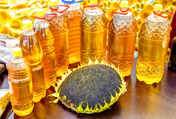 Sunflower head with seeds and fresh sunflower oil