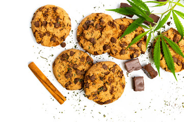 Chocolate chip cookies with marijuana isolated on white