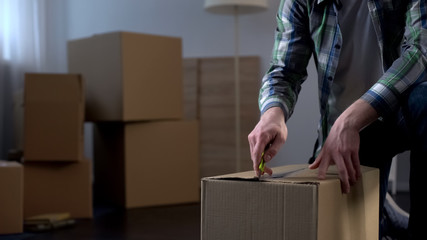 Student settling in hostel, unpacking his things, beginning of independent life