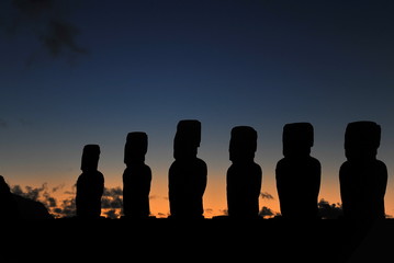 Easter Island. Statues of Moai in the rays of the rising sun.