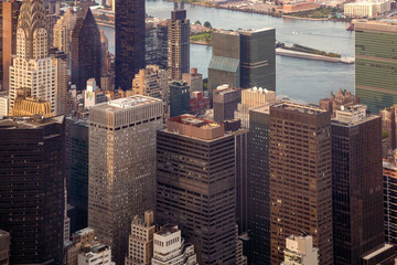 Fototapeta premium New York City Manhattan street aerial view with skyscrapers. Skyscrapers New York. Skyscrapers aerial. Skyscrapers in New York at sunset.