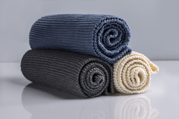 colourful woolen things on white background