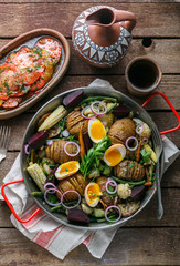 Baked root vegetables in a pan, rustic style
