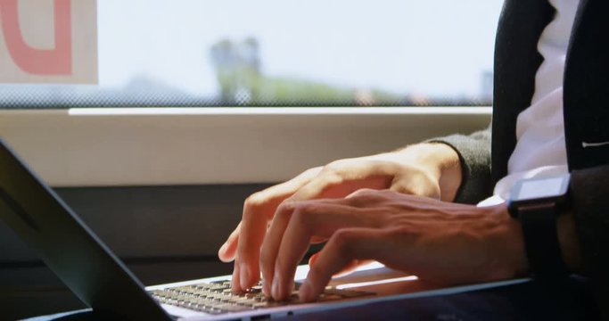 Man using laptop in the bus 4k