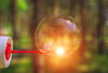 soap bubbles into the sunset with beautiful bokeh.close-up