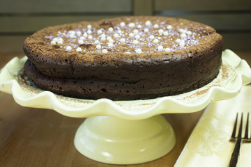 Flourless Chocolate Cakes on a Yellow Pedestal Plate