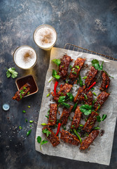 Chinese sticky pork ribs with beer, top view