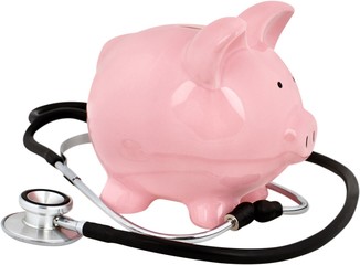 Piggy bank with a stethoscope - financial check up concept