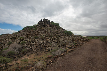 Obraz premium piles of lava rock in the natural oasis of Los Lobos, Canary Islands.