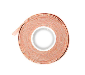Medical sticking plaster roll on white background, top view