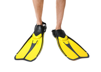 Man wearing yellow flippers on white background, closeup © New Africa