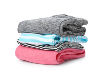 Stack of colorful children's clothes on white background