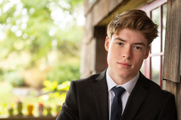 Attractive teenage boy wearing suit