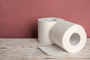 Toilet paper rolls on table. Space for text