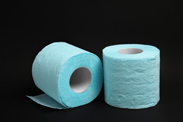 Toilet paper rolls on black background. Personal hygiene