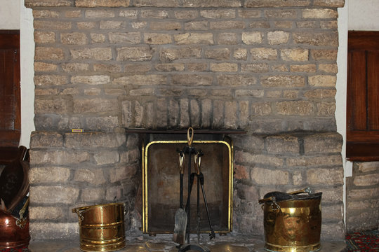 bricked fireplace and fireguard