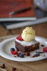 Chocolate brownie with a scoop of ice cream on top 