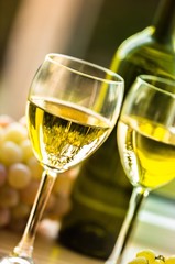 Wine Glasses With Wine Bottle And White Grape Cluster In