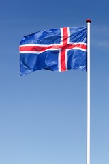 Fototapeta na wymiar Flag of Iceland waving in the sky
