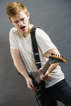 Man playing on electric guitar