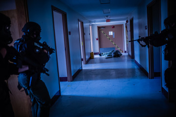 Tactical Team Training in an Abandoned Hospital  - obrazy, fototapety, plakaty