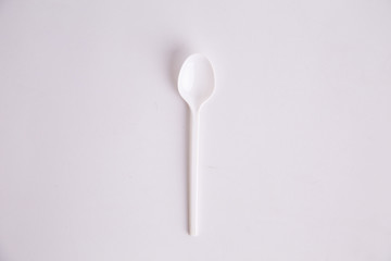 plastic spoon on colorful background