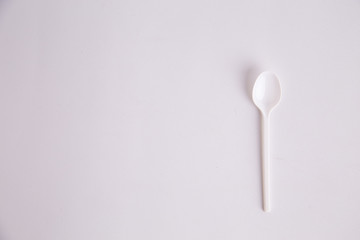 plastic spoon on colorful background