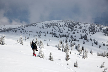 trekking in snowy winter mountains