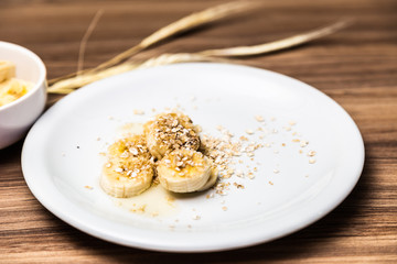 babana with honey and oats. Nutritious and healthy food