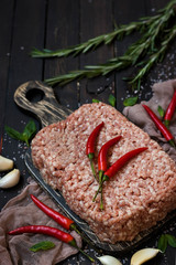 Raw meat with fresh herbs and pink Himalayan salt