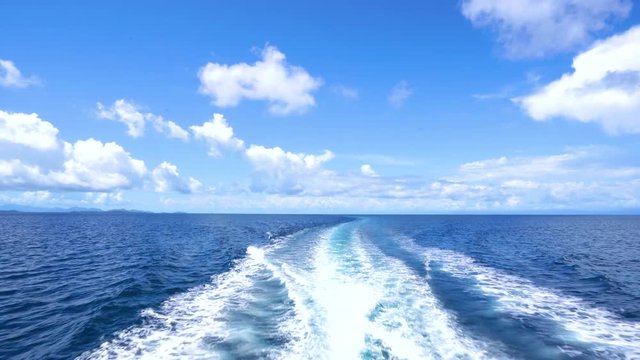 Trace tail of speed boat on water surface in the sea