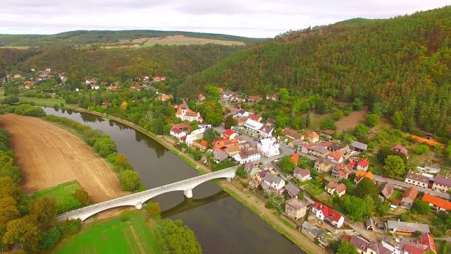Camera flight over The Berounka river near Zbecno. Beautiful natural park in Czech Republic. European landmarks from above.