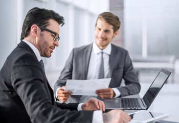 employees discussing financial data