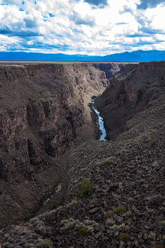 Rio Grande Gorge, looking south from the US Hwy 64 bridge over the 800' deep chasm, which lies on the Taos Plateau in New Mexico, paralling the Sangre de Cristo Mountains