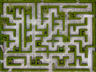 Garden Decoration is a maze with Green leaves wall fence with concrete