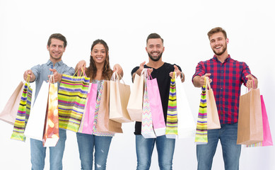 young people showing their colorful shopping bags