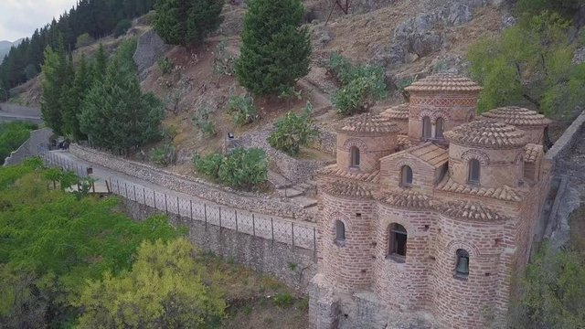 Stunning 4k backwards aerial, church in Stilo, in the valleys of Calabria, Italy